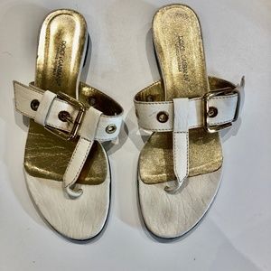 Dolce and Gabbana flat cream sandals with gold buckle accents; 8 1/2